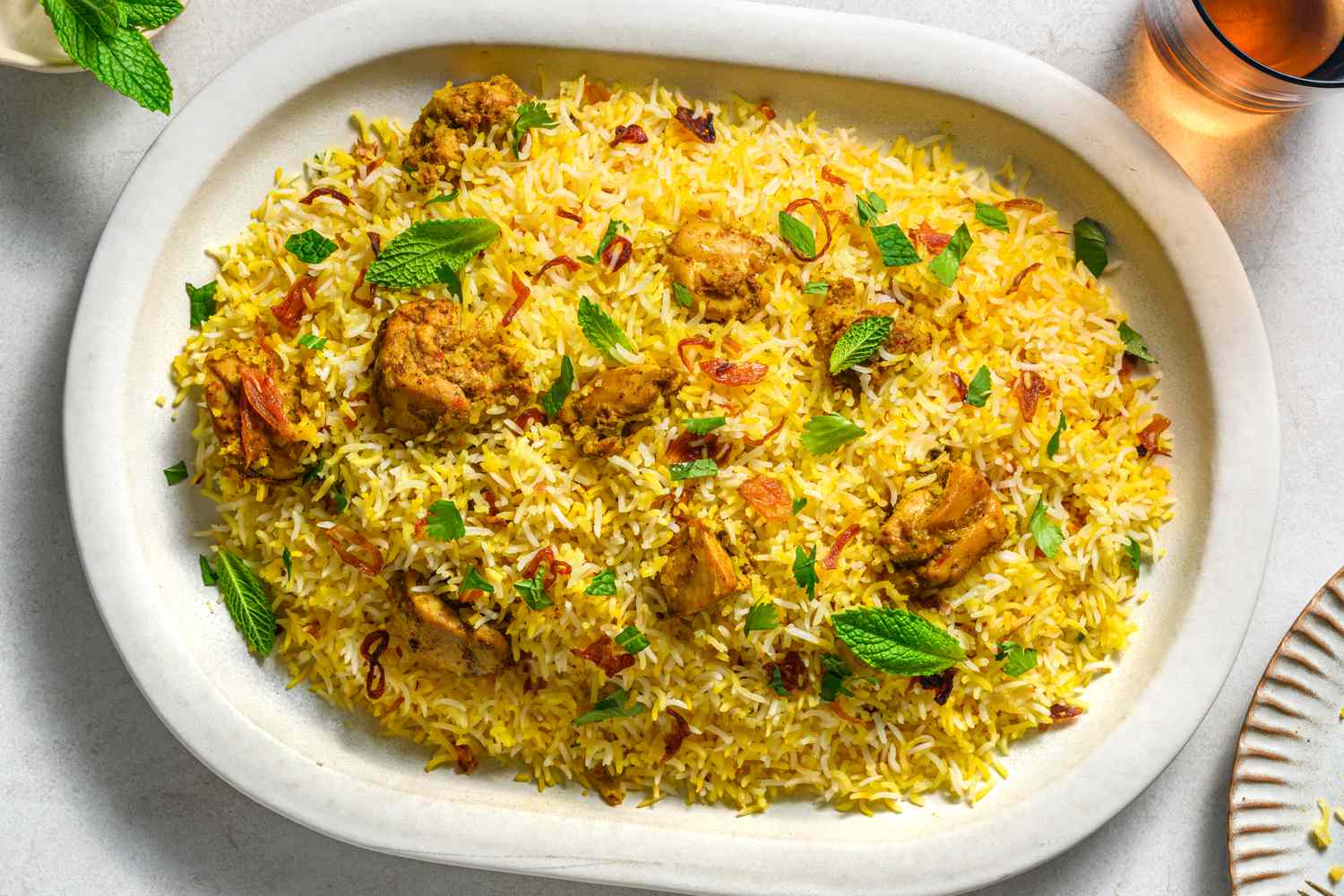 A flavorful bowl of Kolkata Biryani with potatoes and boiled egg 